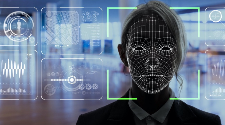 A woman's face being captured and analyzed by facial recognition video security software.