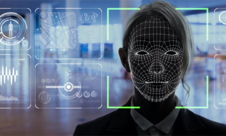 A woman's face being captured and analyzed by facial recognition video security software.