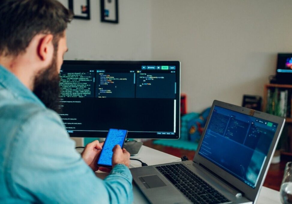 man sitting with mobile in hand