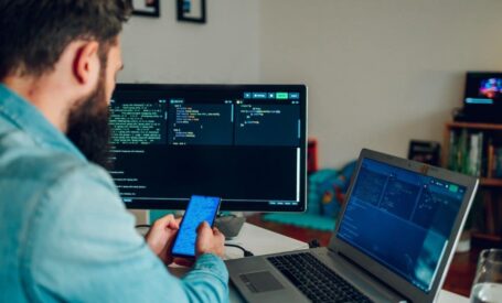 man sitting with mobile in hand