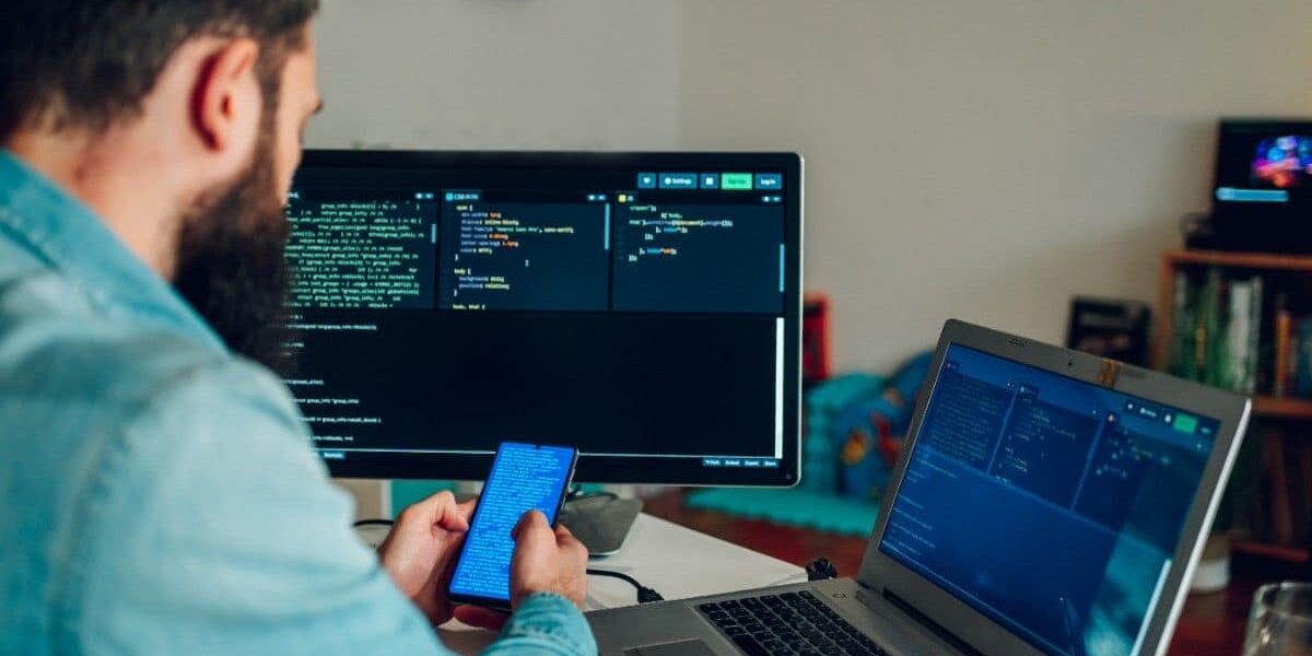 man sitting with mobile in hand